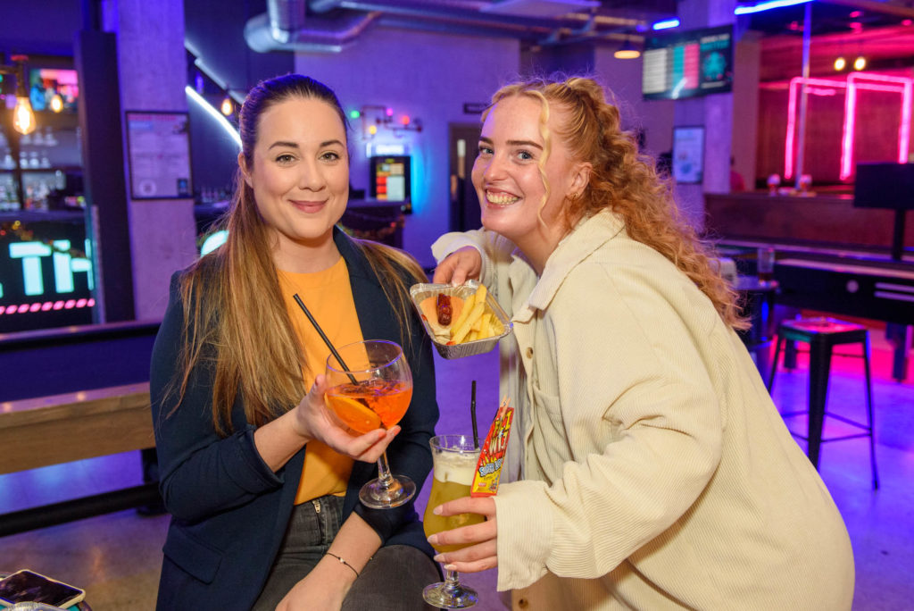Two Girls having fun in a Cocktail Bar.